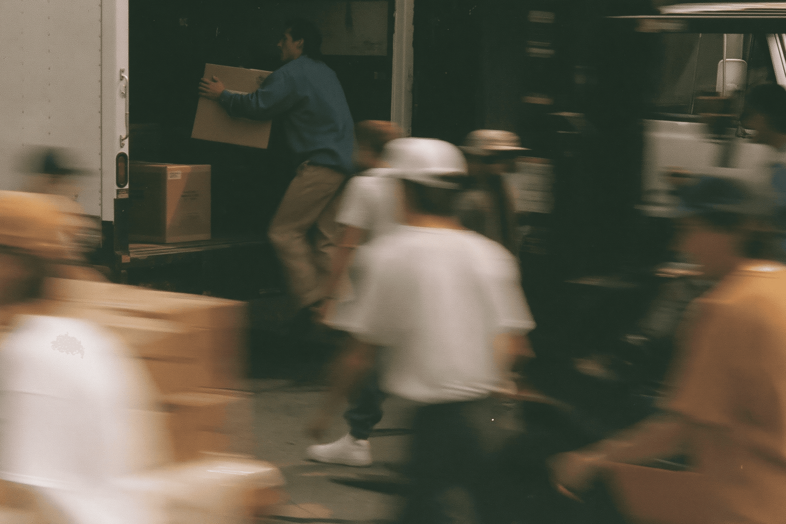 Warehouse team moving fast, loading a truck